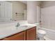 Clean bathroom featuring a vanity with storage, toilet, and shower-tub combination at 9243 W Brown St, Peoria, AZ 85345