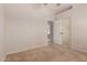 Bedroom featuring neutral walls, plush carpet, an open door, and mirrored closet doors at 9243 W Brown St, Peoria, AZ 85345