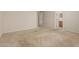 Large carpeted bedroom with view to the ensuite bathroom at 9243 W Brown St, Peoria, AZ 85345
