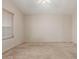 Bright bedroom with neutral walls, plush carpet, and a window with light-filtering blinds at 9243 W Brown St, Peoria, AZ 85345