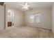 Bright bedroom with ensuite bathroom and ceiling fan at 9243 W Brown St, Peoria, AZ 85345