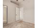 Bedroom featuring neutral walls, plush carpet, an open door, and mirrored closet doors at 9243 W Brown St, Peoria, AZ 85345