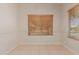 Dining area featuring tile flooring, neutral walls, and dual windows with wood-style blinds at 9243 W Brown St, Peoria, AZ 85345