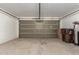 Spacious garage offering ample storage with a gray door and concrete flooring at 9243 W Brown St, Peoria, AZ 85345