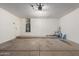 Spacious garage with a utility sink, water heater, and ample room for storage at 9243 W Brown St, Peoria, AZ 85345