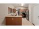 Functional kitchen features stainless steel appliances, oak cabinets, laminate countertops and tile flooring at 9243 W Brown St, Peoria, AZ 85345
