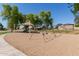 Community playground featuring swings, a slide, and shaded picnic tables for Gathering gatherings at 9243 W Brown St, Peoria, AZ 85345