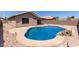 Backyard pool featuring a unique rock border and desert landscaping at 9243 W Brown St, Peoria, AZ 85345