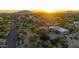Bird's eye view of a home nestled within desert vegetation, capturing the home's setting at sunrise at 9432 E Quail Trl, Carefree, AZ 85377
