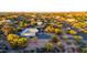 Aerial view of a desert home with a courtyard-style entrance, surrounded by desert flora at 9432 E Quail Trl, Carefree, AZ 85377