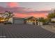 Beautiful home featuring neutral tones, a spacious driveway, desert landscaping, and a charming covered porch at 9432 E Quail Trl, Carefree, AZ 85377