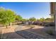 Front yard featuring desert landscaping, decorative brick walkway, and stone accent wall at 9432 E Quail Trl, Carefree, AZ 85377
