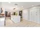 Spacious open kitchen featuring a center island, white cabinetry, stainless appliances, and wood flooring at 9432 E Quail Trl, Carefree, AZ 85377
