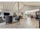 Spacious living room featuring vaulted ceilings, wood flooring, and an open floor plan at 9432 E Quail Trl, Carefree, AZ 85377