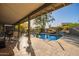 Luxurious outdoor pool area with desert views, spacious patio and seating at 9432 E Quail Trl, Carefree, AZ 85377