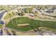 Picture-perfect aerial view of a lush golf course and community, featuring well-manicured greens and surrounding homes at 10102 E Michigan Ave, Sun Lakes, AZ 85248