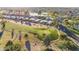 Picturesque aerial view of community showcasing a lush golf course and waterfront property at 10102 E Michigan Ave, Sun Lakes, AZ 85248