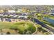 Picturesque aerial view of community showcasing a lush golf course and waterfront property at 10102 E Michigan Ave, Sun Lakes, AZ 85248