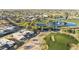 Breathtaking aerial view of the community highlighting the golf course and pond views at 10102 E Michigan Ave, Sun Lakes, AZ 85248