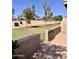 A view of the golf course from the backyard patio at 10102 E Michigan Ave, Sun Lakes, AZ 85248