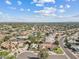 Beautiful aerial view showcases the residential neighborhood with lush landscaping, swimming pools, and winding streets at 10205 E Corrine Dr, Scottsdale, AZ 85260