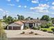 Expansive aerial view of a luxurious home with mature landscaping and a tile roof at 10205 E Corrine Dr, Scottsdale, AZ 85260