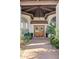 Elegant double front door with decorative wreaths under a covered entryway at 10205 E Corrine Dr, Scottsdale, AZ 85260