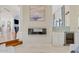 Elegant living space featuring a fireplace and a bar area with refined finishes at 10205 E Corrine Dr, Scottsdale, AZ 85260
