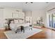 Spacious main bedroom with French doors, wooden floors and sitting area at 10205 E Corrine Dr, Scottsdale, AZ 85260