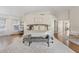 Bright main bedroom featuring a large bed, hardwood floors and sitting area at 10205 E Corrine Dr, Scottsdale, AZ 85260