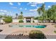 Inviting in-ground pool features desert landscaping, a cabana, and ample deck space at 10205 E Corrine Dr, Scottsdale, AZ 85260