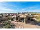 Aerial view showcasing the home's private backyard, patio, and proximity to mountain views at 10607 E Hillside Mine Ct, Gold Canyon, AZ 85118