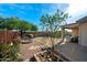 Backyard with desert landscaping, fire pit, seating and mountain views offering an ideal outdoor space at 10607 E Hillside Mine Ct, Gold Canyon, AZ 85118