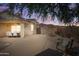 Relaxing desert backyard with mountain views, featuring a covered patio, seating and stone landscaping at 10607 E Hillside Mine Ct, Gold Canyon, AZ 85118
