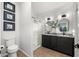 This bathroom features granite countertops, dual sinks, decorative mirrors, modern lighting, a shower, and a toilet at 10607 E Hillside Mine Ct, Gold Canyon, AZ 85118