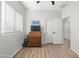 This bedroom features wood-look floors, a closet, and a window overlooking the side yard at 10607 E Hillside Mine Ct, Gold Canyon, AZ 85118