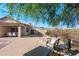 Enjoy outdoor dining and relaxation on this spacious patio with beautiful mountain views at 10607 E Hillside Mine Ct, Gold Canyon, AZ 85118