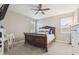 Comfortable bedroom with ceiling fan, windows, and nice furniture at 1281 W Highland Rd, San Tan Valley, AZ 85143