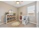 Bedroom with ample sunlight, featuring toys, a ceiling fan, and carpet flooring at 1281 W Highland Rd, San Tan Valley, AZ 85143