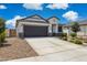 Charming single-story home with a well-manicured lawn and a two-car garage at 1281 W Highland Rd, San Tan Valley, AZ 85143