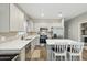 Modern kitchen with stainless steel appliances, white countertops, and a central island at 1281 W Highland Rd, San Tan Valley, AZ 85143
