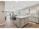 Bright open concept, showcasing kitchen, dining area, and living room with access to backyard at 1281 W Highland Rd, San Tan Valley, AZ 85143