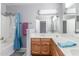 Well-lit bathroom featuring a shower-tub combo and wooden vanity at 12813 S 38Th St, Phoenix, AZ 85044