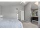 Cozy bedroom featuring neutral colors, carpet, a closet, and a bathroom at 12813 S 38Th St, Phoenix, AZ 85044