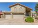 Charming home with a red tiled roof, three-car garage, and desert landscaping at 12813 S 38Th St, Phoenix, AZ 85044