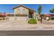 Charming home with a red tiled roof, three-car garage, and well maintained desert landscaping at 12813 S 38Th St, Phoenix, AZ 85044