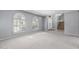 A bright living room features neutral walls, carpet flooring, and lots of natural light at 12813 S 38Th St, Phoenix, AZ 85044