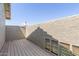 Empty outdoor patio area with wood floors and textured walls at 12813 S 38Th St, Phoenix, AZ 85044
