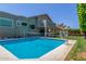Inviting backyard pool boasts a volleyball net and basketball hoop for outdoor fun at 12813 S 38Th St, Phoenix, AZ 85044