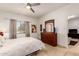 Cozy bedroom with neutral tones, featuring a dresser and window with natural light at 145 N 74Th St # 251, Mesa, AZ 85207